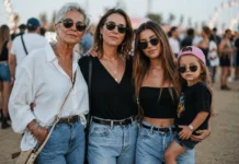 Cuatro generaciones de mujeres modernas en un festival, abuela, madre, hija y niña con gorra, representando estilo de vida activo y convivencia con diabetes